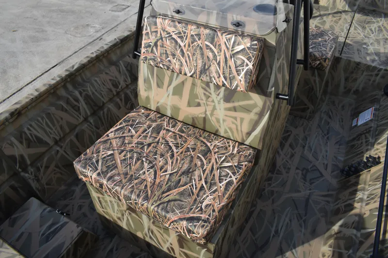 Slide: The Image of 2026 Lowe Roughneck RX1860 Tunnel Jet boat with open storage compartments. - 16