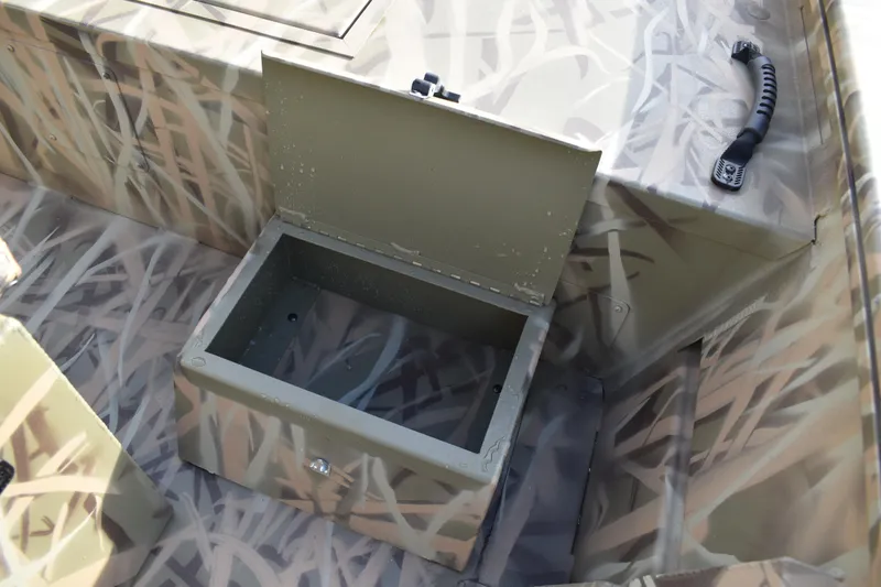 Slide: The Image of 2026 Lowe Roughneck RX1860 Tunnel Jet boat with camouflage interior design. - 21