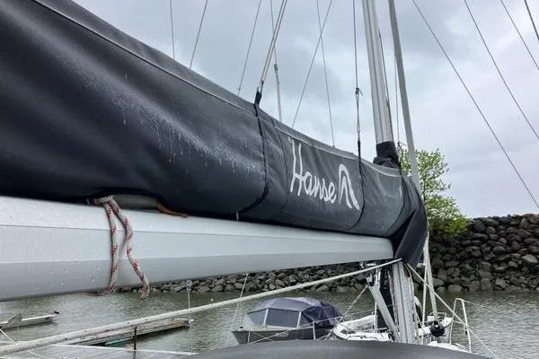 Slide: The Image of Sailboat Hanse 315, 2017 model, docked with covered boom in a marina. - 13