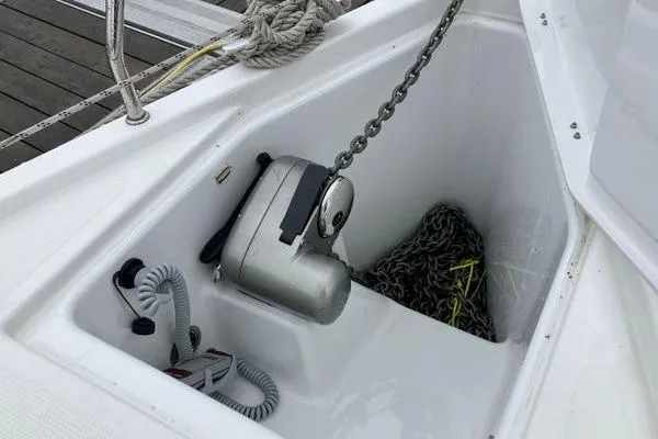 Slide: The Image of Anchor compartment of 2017 Hanse 315 sailboat with chain and winch. - 17