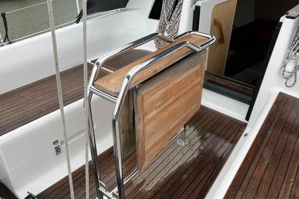 Slide: The Image of 2017 Hanse 315 yacht cockpit with wooden flooring and foldable table. - 19