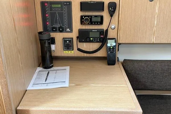 Slide: The Image of Control panel and desk area inside a 2017 Hanse 315 yacht. - 26