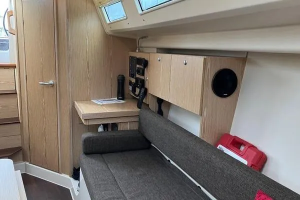 Slide: The Image of Interior of 2017 Hanse 315 sailboat with wooden cabinetry and seating area. - 27