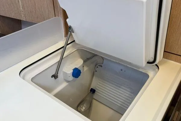 Slide: The Image of Open storage compartment in a 2017 Hanse 315 yacht interior. - 30