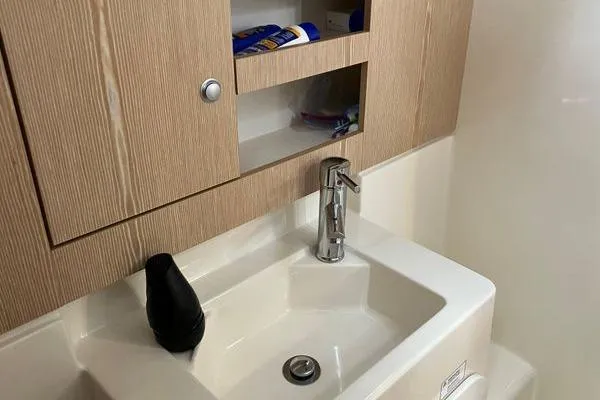 Slide: The Image of Compact bathroom sink with wooden cabinet in 2017 Hanse 315 yacht. - 34
