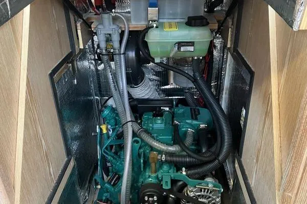 Slide: The Image of Engine compartment of a 2017 Hanse 315 sailboat, showcasing mechanical components and insulation. - 35