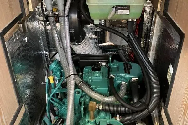 Slide: The Image of Engine compartment of a 2017 Hanse 315 sailboat, featuring a well-organized mechanical setup. - 37