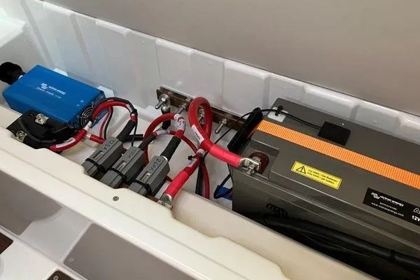 Slide: The Image of Electrical system components in a 2017 Hanse 315 yacht, featuring wiring and battery setup. - 40