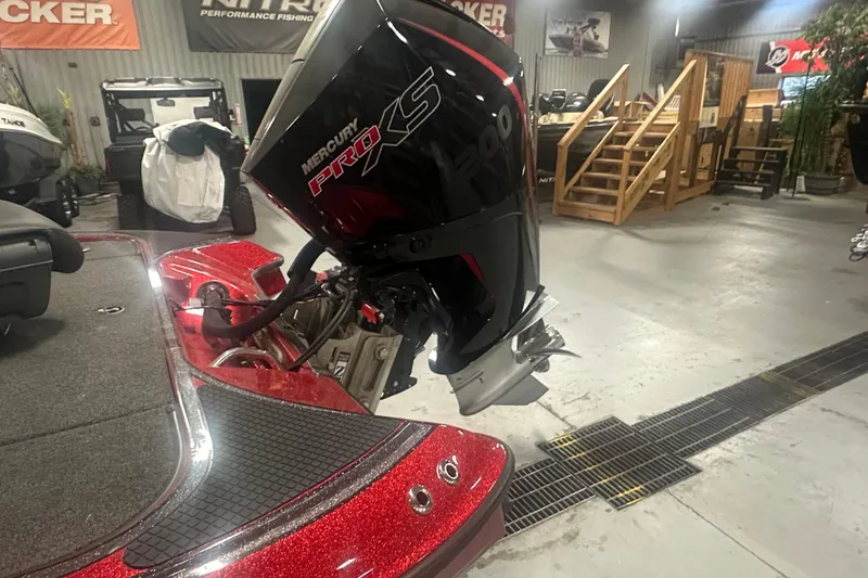 Slide: The Image of 2019 Triton 18 TrX boat with Mercury Pro XS engine in showroom. - 8