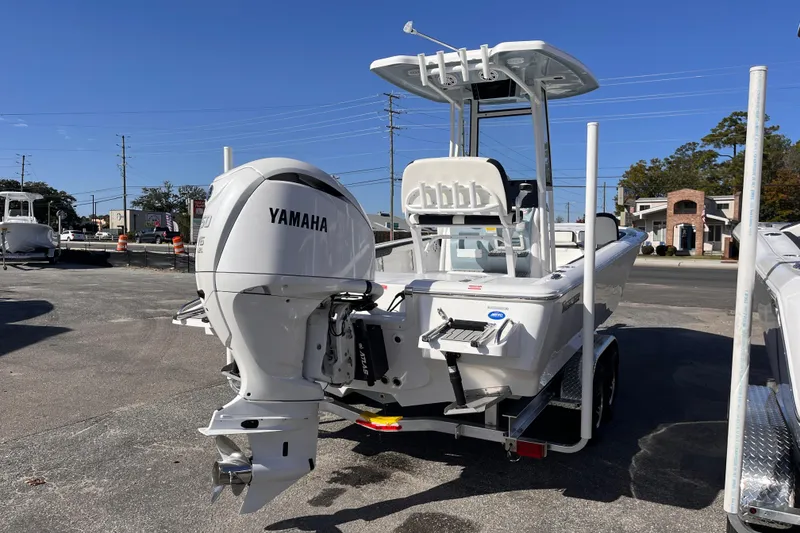Slide: The Image of 2026 Tidewater 2300 Carolina Bay boat with Yamaha engine, parked outdoors. - 4
