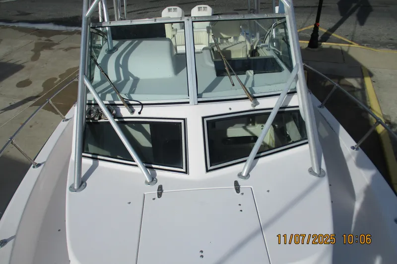 Slide: The Image of 1996 Grady-White Sailfish 272 boat, front view with windshield and railings. - 11