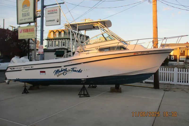 Slide: The Image of 1996 Grady-White Sailfish 272 boat on display at a marina. - 22