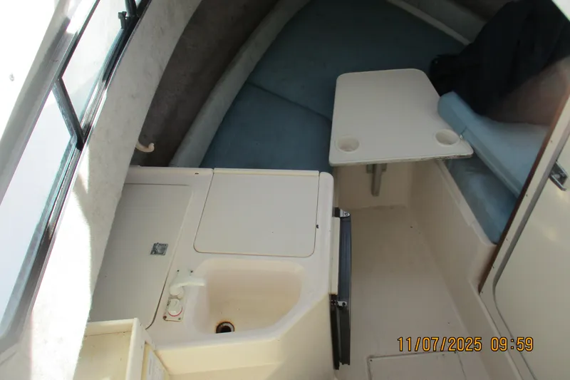 Slide: The Image of Interior cabin of 1996 Grady-White Sailfish 272 with seating and small sink. - 5