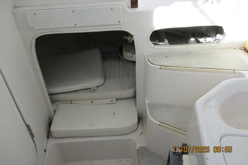 Slide: The Image of Interior cabin of 1996 Grady-White Sailfish 272 boat, showing seating and storage. - 6