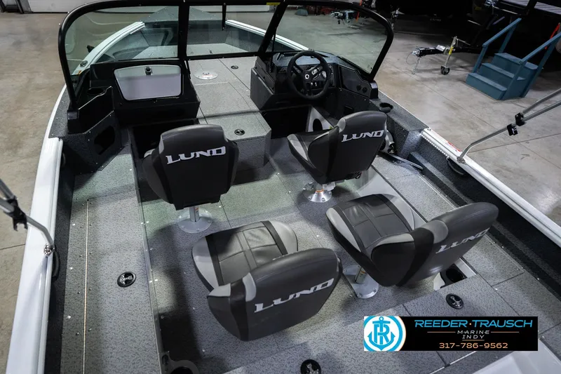 Slide: The Image of 2026 Lund 1700 Explorer Sport boat interior with four seats and steering console. - 15