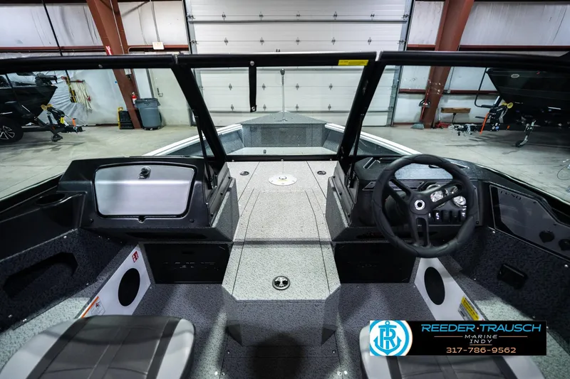 Slide: The Image of Interior view of 2026 Lund 1700 Explorer Sport boat, featuring steering wheel and dashboard. - 17
