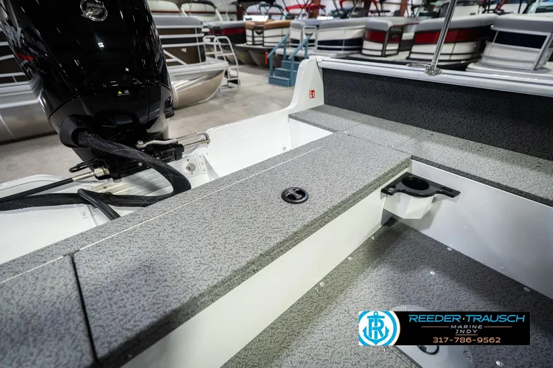 Slide: The Image of 2026 Lund 1700 Explorer Sport boat interior with motor, showcased at Reeder-Trausch Marine. - 24