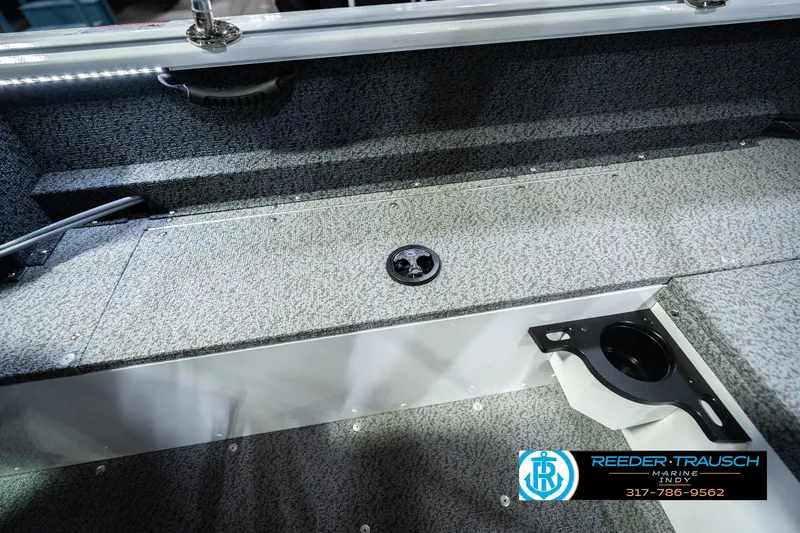 Slide: The Image of Interior of 2026 Lund 1700 Explorer Sport boat with storage and cup holder. - 26