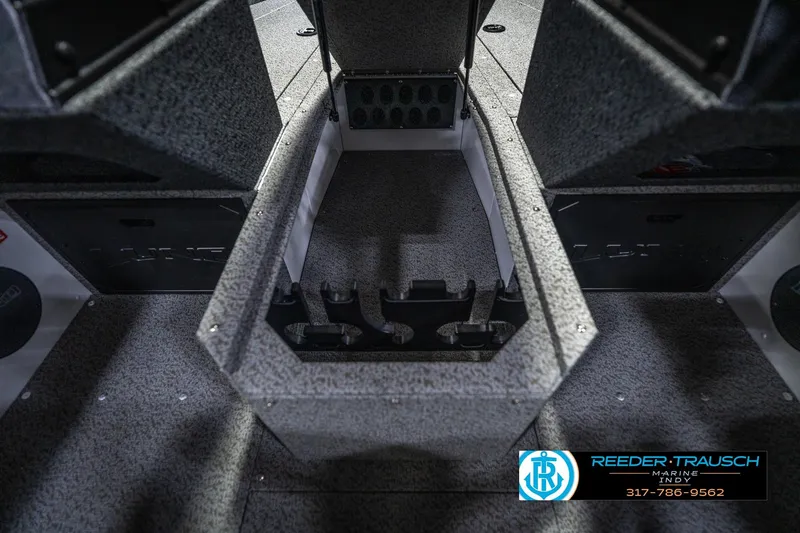 Slide: The Image of 2026 Lund 1700 Explorer Sport boat interior with storage compartments and carpeted flooring. - 29