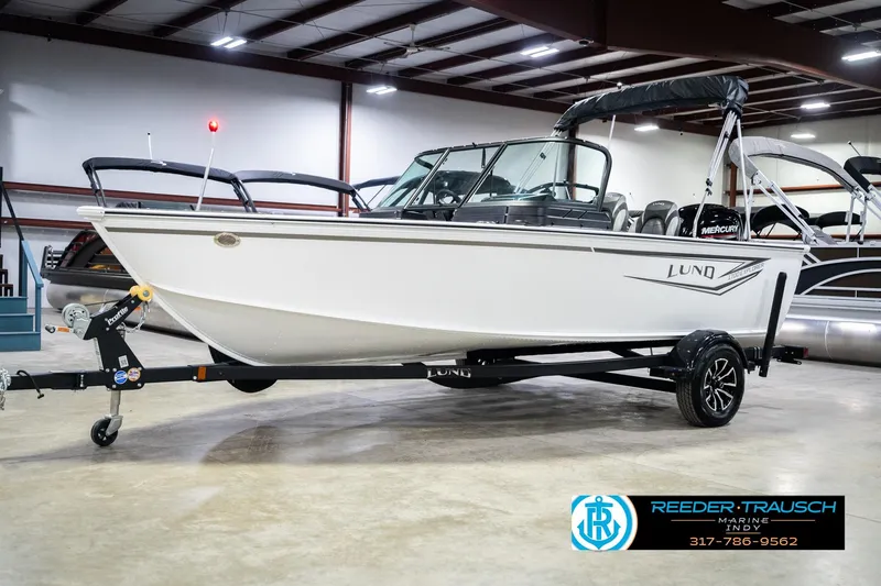 Slide: The Image of 2026 Lund 1700 Explorer Sport boat on trailer in indoor showroom. - 3