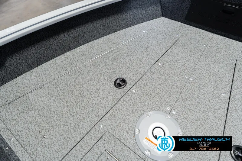 Slide: The Image of 2026 Lund 1700 Explorer Sport boat deck with textured surface and storage compartments. - 30