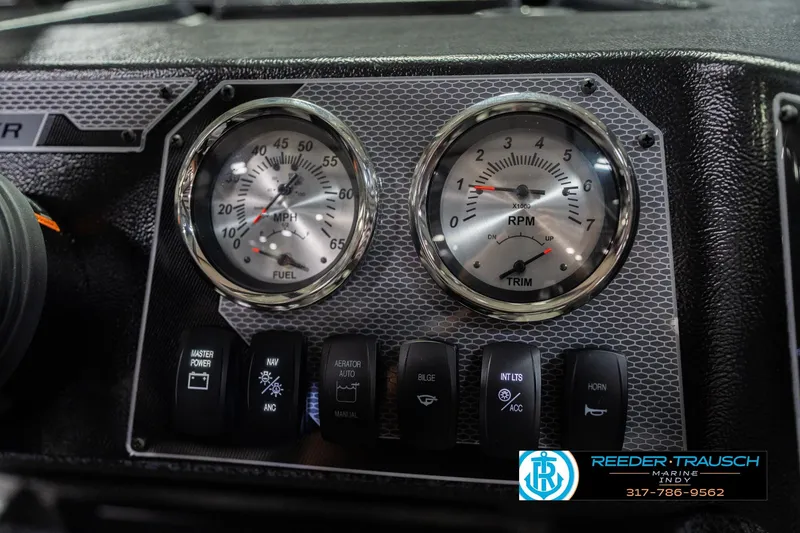 Slide: The Image of Dashboard of 2026 Lund 1700 Explorer Sport with gauges and control switches. - 35