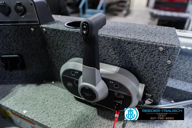Slide: The Image of Control panel of 2026 Lund 1700 Explorer Sport boat with throttle lever. - 36