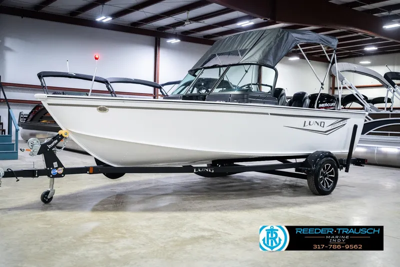 Slide: The Image of 2026 Lund 1700 Explorer Sport boat on trailer in indoor showroom. - 4