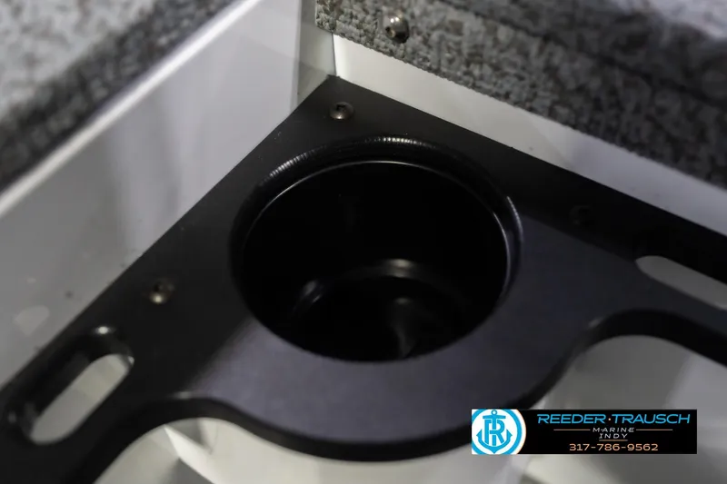 Slide: The Image of Cup holder in 2026 Lund 1700 Explorer Sport boat interior, featuring Reeder-Trausch Marine logo. - 41