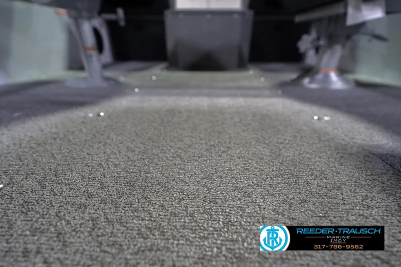 Slide: The Image of 2026 Lund 1700 Explorer Sport boat interior with carpeted flooring. - 42