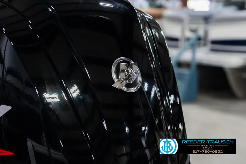 Slide: The Image of Close-up of 2026 Lund 1700 Explorer Sport boat emblem in showroom. - 46