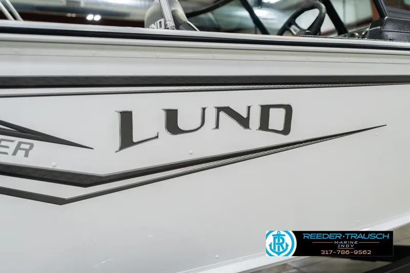 Slide: The Image of 2026 Lund 1700 Explorer Sport boat side view with logo and dealership contact. - 48