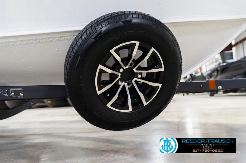 Slide: The Image of 2026 Lund 1700 Explorer Sport trailer wheel, black and silver design, Reeder Trausch Marine logo. - 53