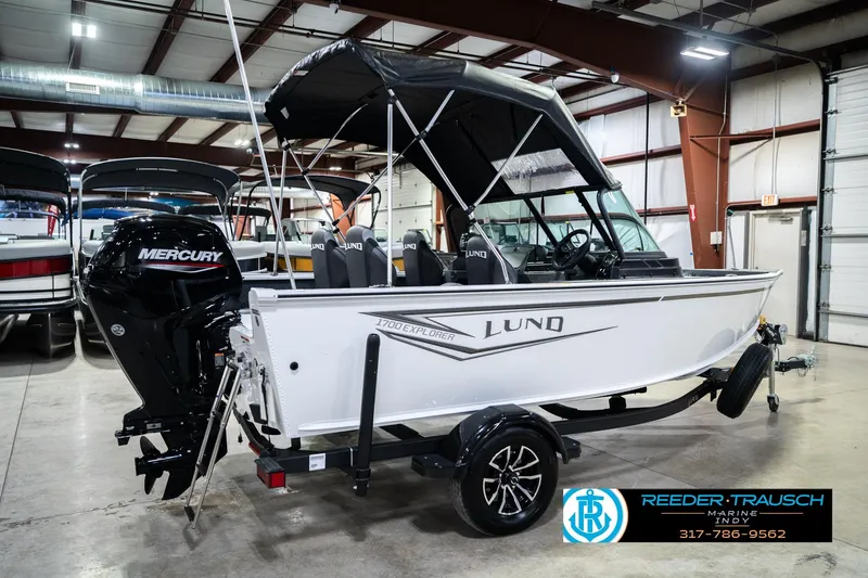 Slide: The Image of 2026 Lund 1700 Explorer Sport boat with Mercury engine in showroom. - 8