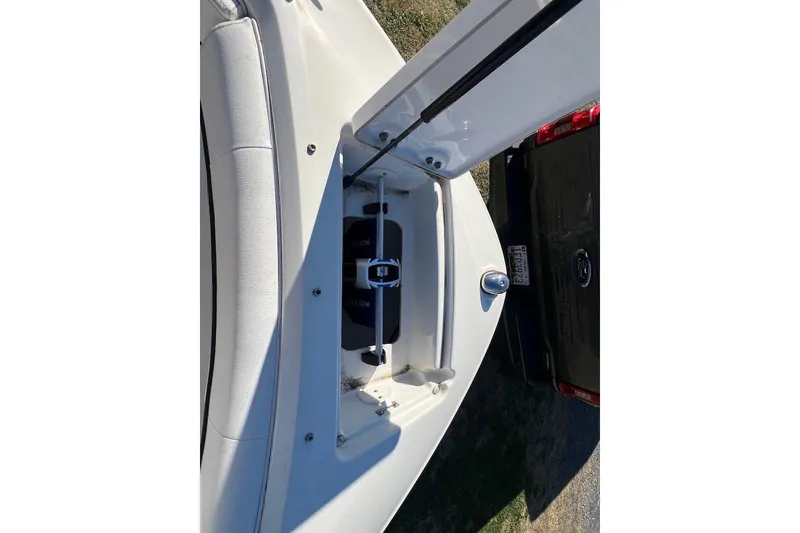Slide: The Image of Open storage compartment on 2016 Sea Ray 230 SLX boat, showing interior details. - 21