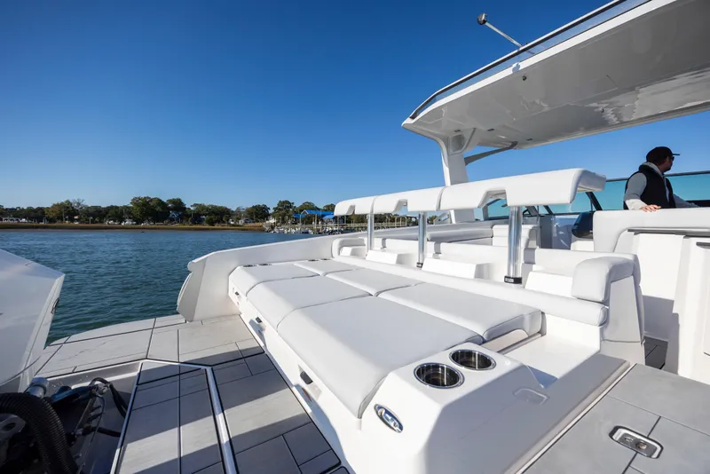 Slide: The Image of 2023 Aviara AV32 OB luxury boat with spacious seating and sleek design on a sunny day. - 14