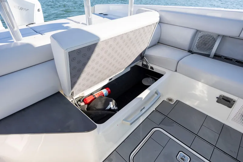 Slide: The Image of 2023 Aviara AV32 OB boat with open storage compartment and seating area. - 29