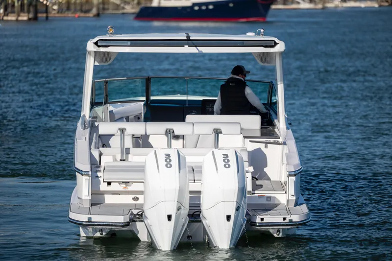 Slide: The Image of 2023 Aviara AV32 OB boat with dual outboard engines on the water. - 3