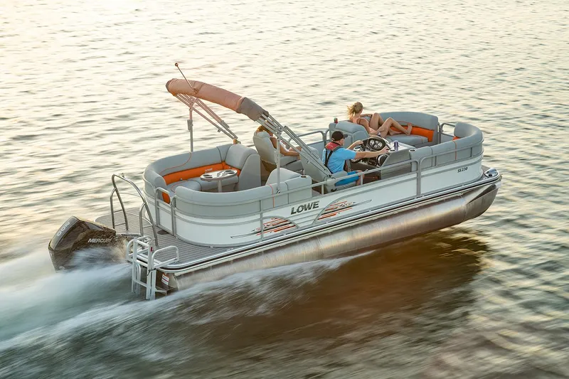 Slide: The Image of 2021 Lowe SS 230 WT pontoon boat with Mercury outboard engine on gravel. - 10