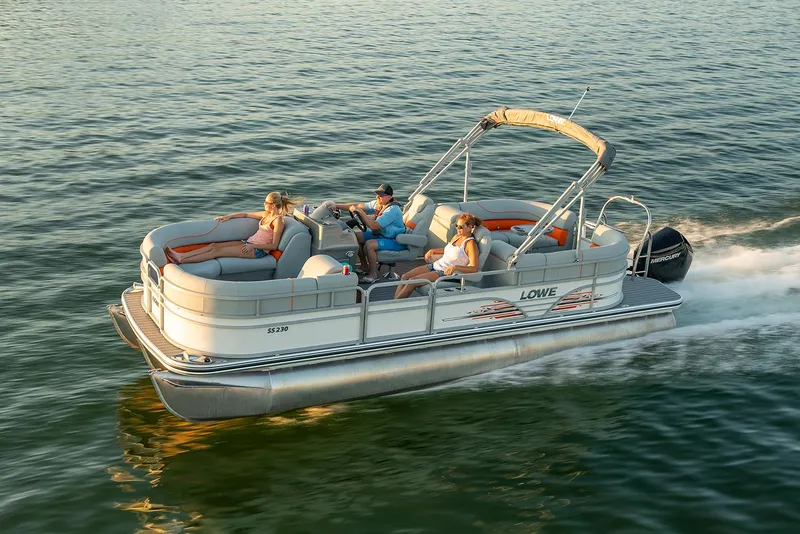 Slide: The Image of 2021 Lowe SS 230 WT pontoon boat with Mercury 115 engine on gravel. - 11