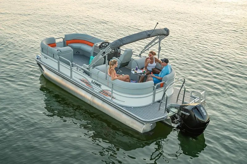 Slide: The Image of 2021 Lowe SS 230 WT pontoon boat with Mercury outboard motor on gravel lot. - 12
