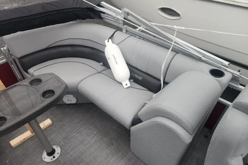 Slide: The Image of 2021 Lowe SS 230 WT boat with Mercury engine and swim ladder. - 19