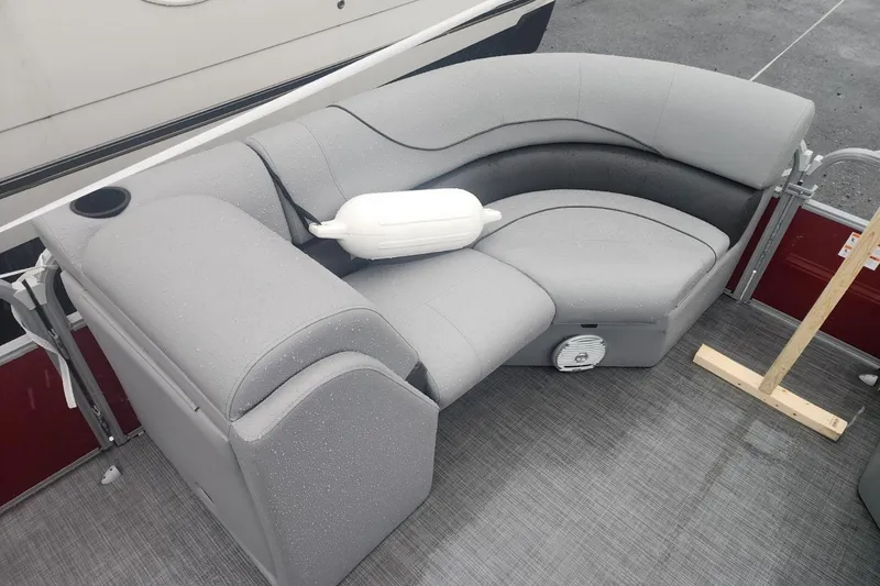 Slide: The Image of 2021 Lowe SS 230 WT pontoon boat with gray seating and table. - 23