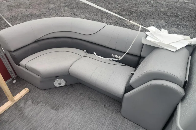 Slide: The Image of 2021 Lowe SS 230 WT boat dashboard with steering wheel and control panel. - 24