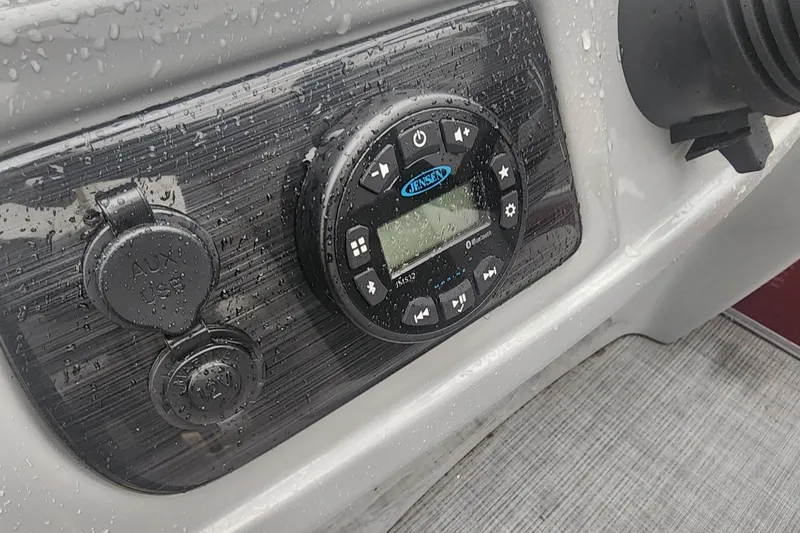 Slide: The Image of 2021 Lowe SS 230 WT pontoon boat interior with steering console and seating. - 25