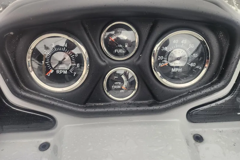 Slide: The Image of 2021 Lowe SS 230 WT boat interior with gray seating and a white fender. - 26