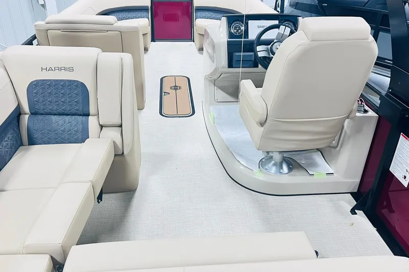 Slide: The Image of 2025 Harris Solstice 250 interior with luxurious beige seating and modern dashboard. - 11