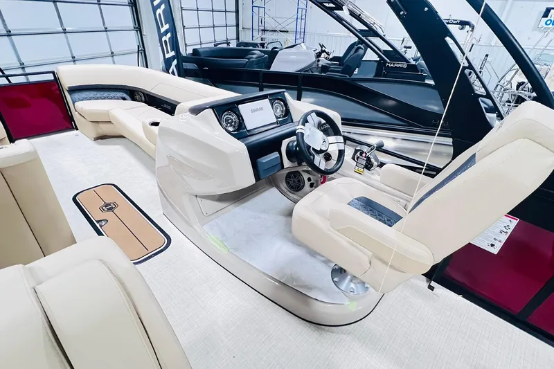 Slide: The Image of Luxurious interior of 2025 Harris Solstice 250 boat with modern helm and seating. - 12