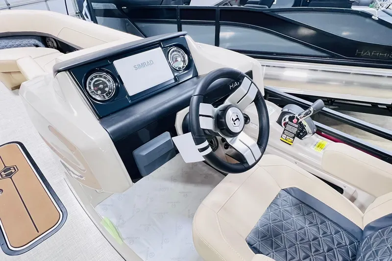 Slide: The Image of 2025 Harris Solstice 250 boat dashboard with steering wheel and control panel. - 15