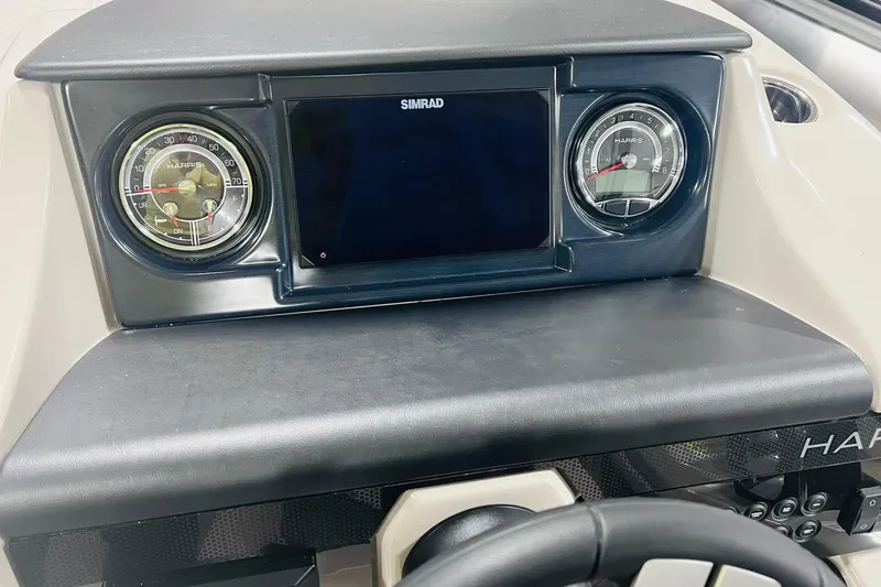 Slide: The Image of Dashboard of 2025 Harris Solstice 250 boat with gauges and Simrad display. - 20